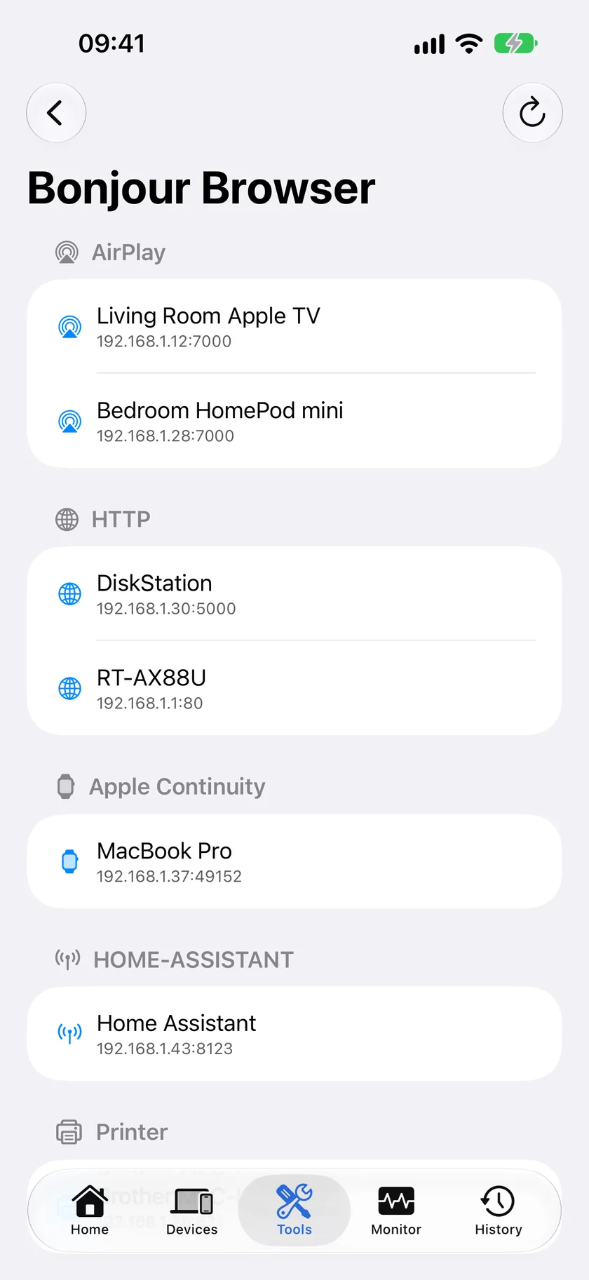 PingKit's Bonjour Browser on iPhone, grouping discovered services by type and showing the device, address and port advertising each one.