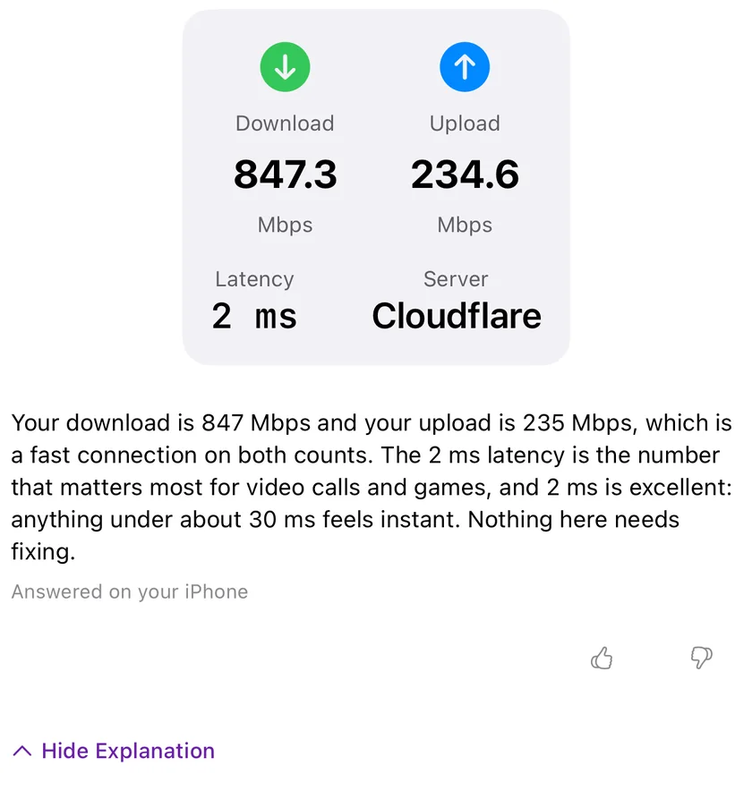 A finished speed test in PingKit for iPhone with Explain This Result expanded underneath it, reading the download, upload and latency back in plain language, captioned Answered on your iPhone.